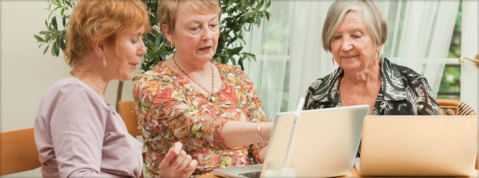 retired women on laptops
